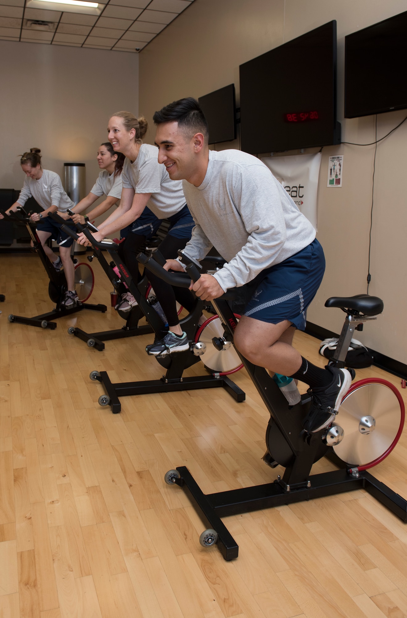 Airmen assigned to Whiteman Air Force Base, Missouri, participate in a cycling class at the Whiteman AFB fitness center on October 10, 2019. The class served as part of the Health and Readiness Optimization (HeRO) strategy, an initiative newly adopted by the Air Force to address targets for health improvements in areas such as physical activity, nutrition, sleep and nicotine cessation. (U.S. Air Force photo by Staff Sgt. Kayla White)