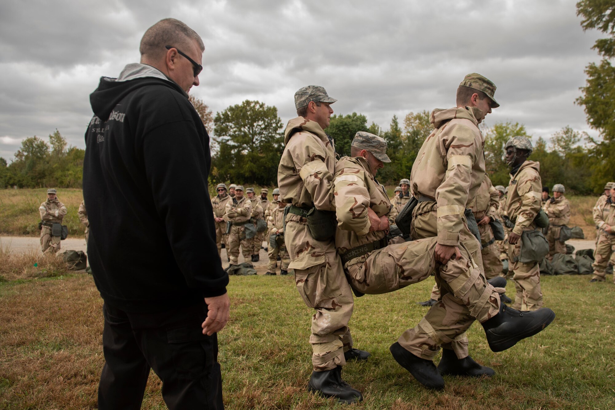 Members of the 375th Air Mobility Wing prepare for a mobility exercise with Ability to Survive and Operate training at Scott Air Force Base, Illinois, Oct. 16, 2019. ATSO training includes elements of Tactical Combat Casualty Care, chemical, biological, radiological, and nuclear defense, Post Attack Reconnaissance sweeps, Unidentified Explosive Ordnance response, and other areas. (U.S. Air Force photo by Senior Airman Daniel Garcia)