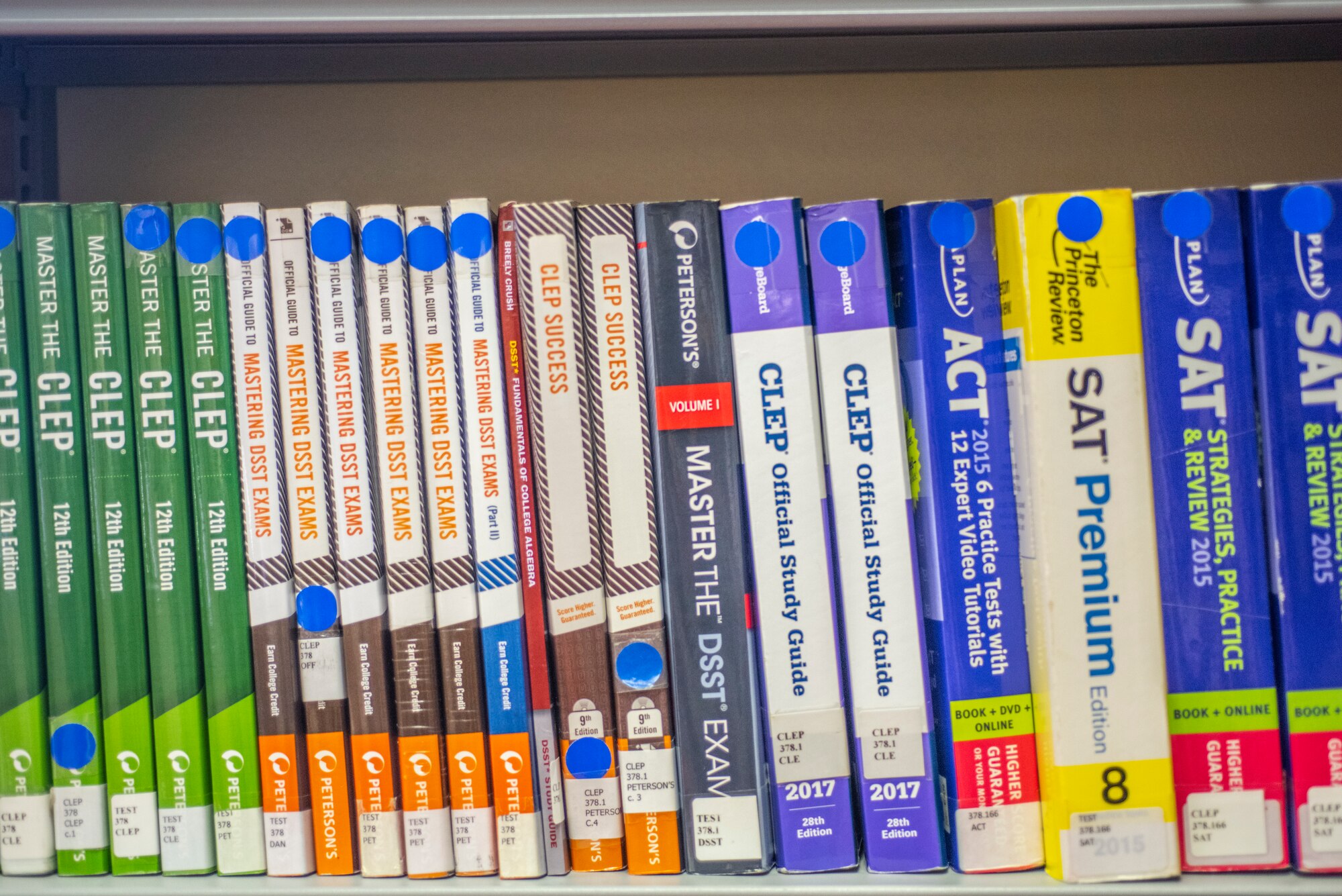 Test preparation books sit on the shelf at the base library Oct. 9, 2019, at RAF Mildenhall, England. The base library has a wide range of professional development resources for Airmen and families to utilize.  (U.S. Air Force photo by Airman 1st Class Joseph Barron)