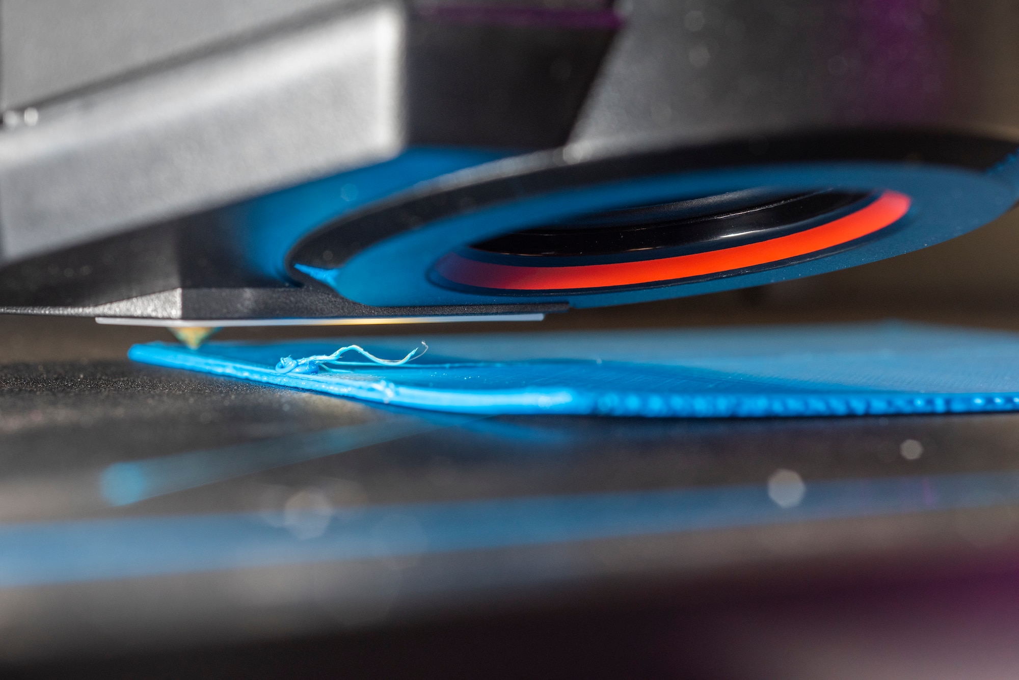 A 3D printer lays down filament at the base library Oct. 10, 2019, at RAF Mildenhall, England. Patrons are free to use the device to print designs they create themselves or download from the internet. (U.S. Air Force photo by Airman 1st Class Joseph Barron)