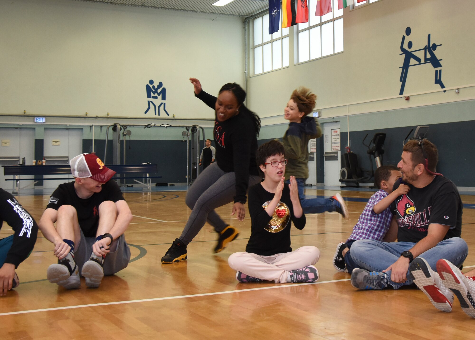 A child chases a U.S. Airman during a round of duck, duck, goose at Vogelweh Military Complex, Germany, Oct. 9, 2019. Special needs children have the opportunity to get physical fitness and form connections with active duty service members during “Vogelweh Gym Sessions” on the second Wednesday of every month during the school year.