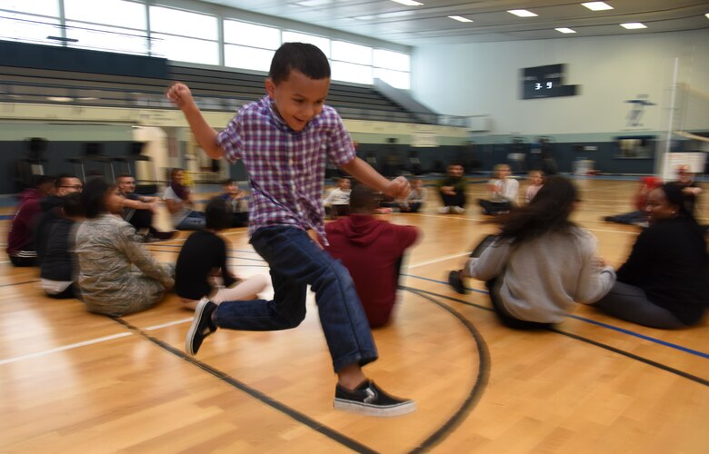 A child plays during a “Vogelweh Gym Session,” at Vogelweh Military Complex, Germany, Oct. 9, 2019. During the sessions, special needs children pair up with an active duty “buddy” to play games like basketball, jump rope, and hula hoop.