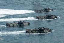 Assault amphibious vehicles participate in an amphibious landing during exercise KAMANDAG 3