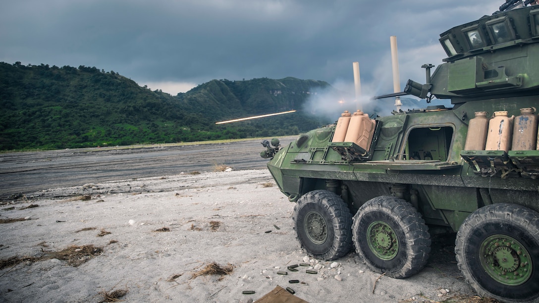 A light armored vehicle with Alpha Company, Battalion Landing Team 3/5, 11th Marine Expeditionary Unit, fires its main gun during a live shoot at Colonel Ernesto Ravina Air Base, Philippines, Oct. 12, 2019 during exercise KAMANDAG 3. KAMANDAG advances military modernization and capability development through subject matter expert exchanges. (U.S. Marine Corps photo by Sgt. Adam Dublinske)
