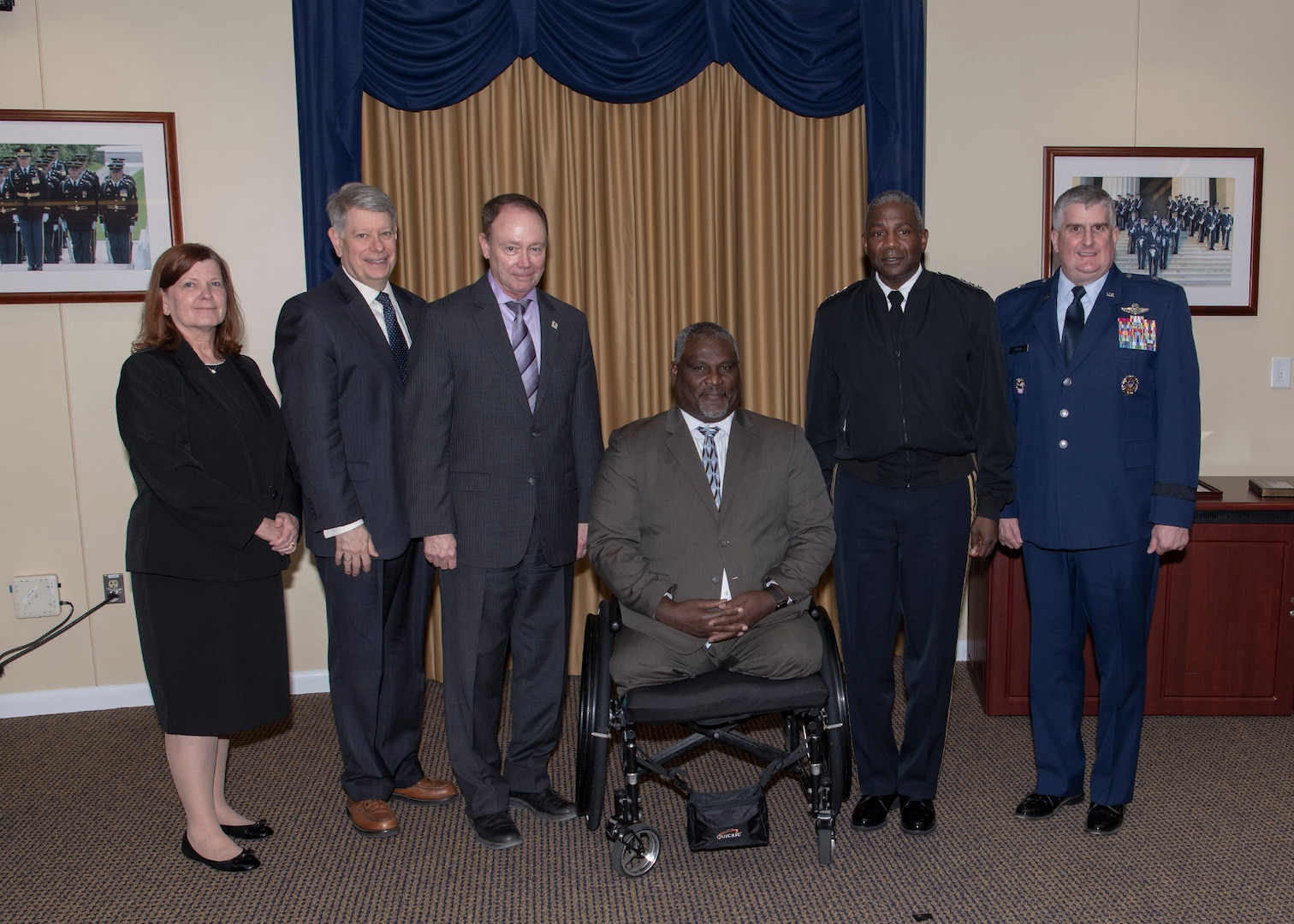 One woman and five men pose following the HQC National Disability Employment Awareness Month event.