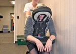 DLA Disposition Services Property Disposal Technician Mary Clyde can’t help but smile as she enjoys a complimentary massage from a local beauty academy student during the Hart-Dole-Inouye Federal Center Health Fair Oct. 16.