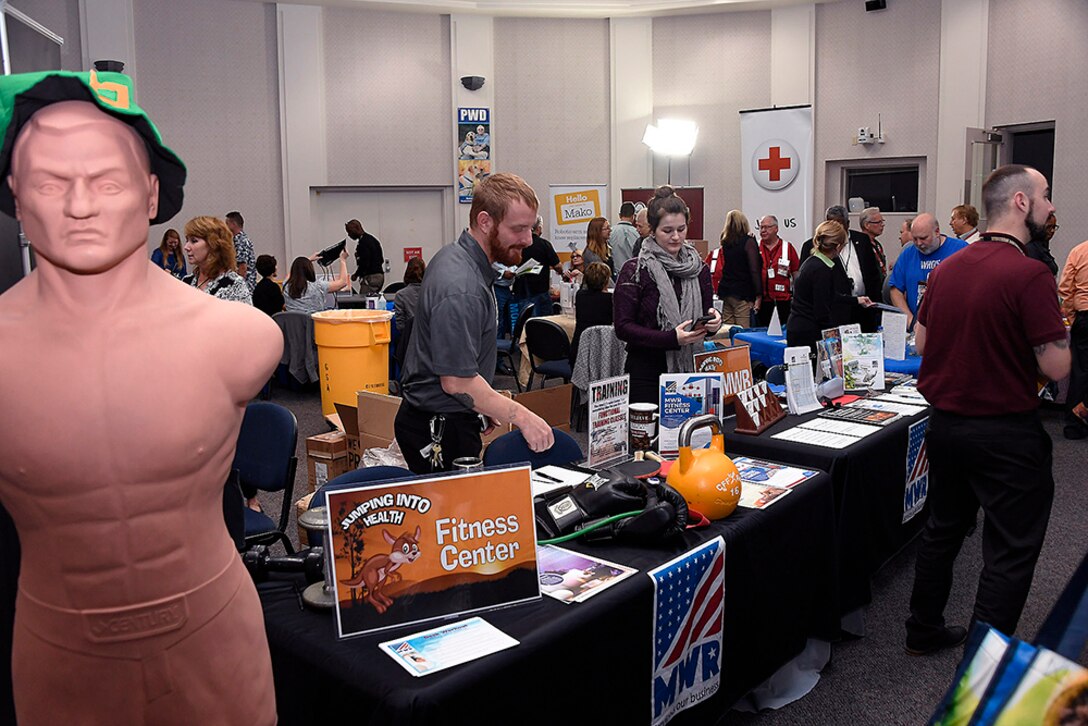 Battle Creek Morale, Welfare and Recreation personnel prepare their exhibit booths at the start of the Occupational Health Unit’s annual Health Fair.