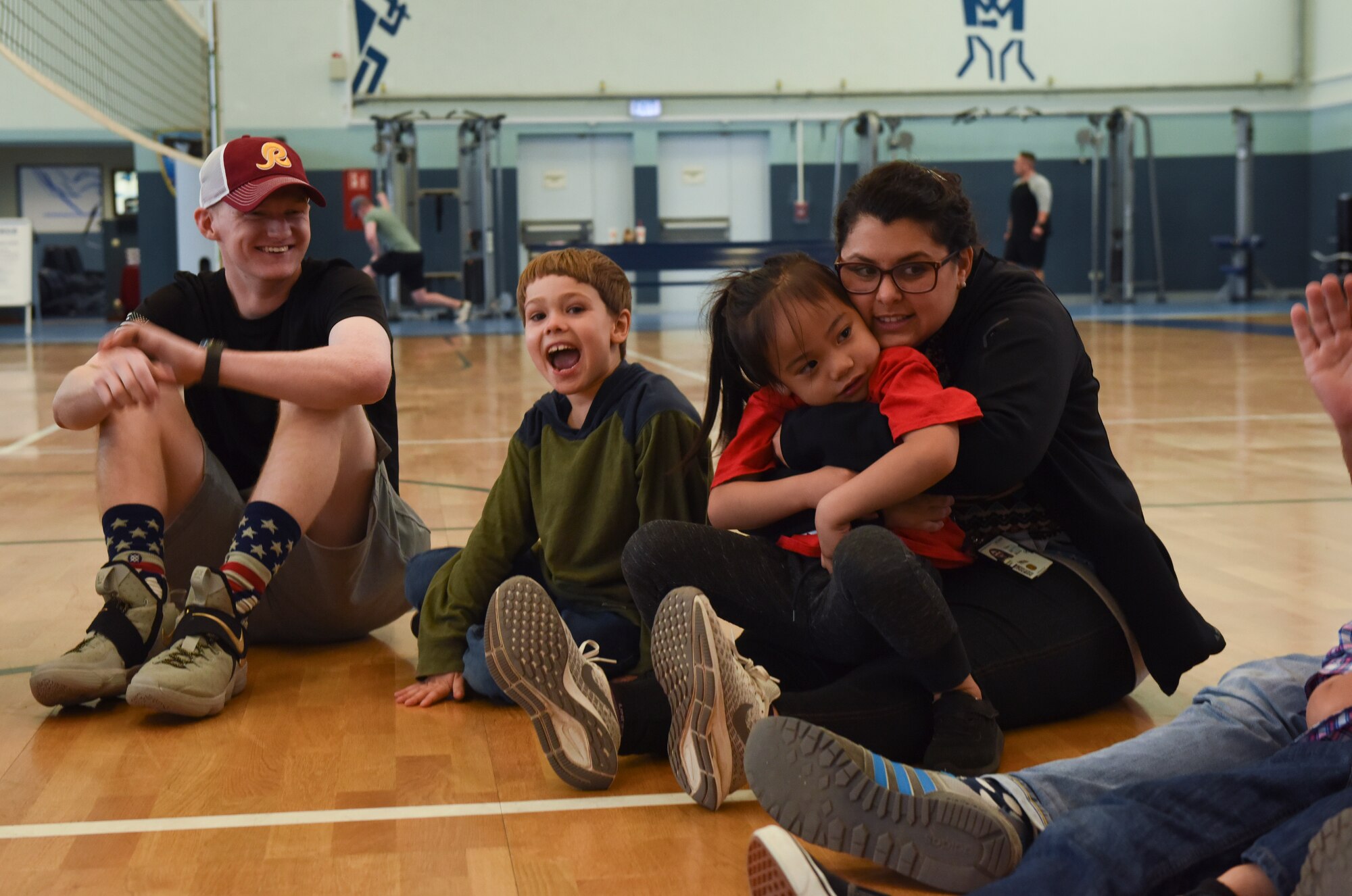Active duty service members, teachers, and special needs children play together at Vogelweh Military Complex, Germany, Oct. 9, 2019. “Vogelweh Gym Sessions,” which have been running for more than two years, pair service members and special needs children to play and build relationships.