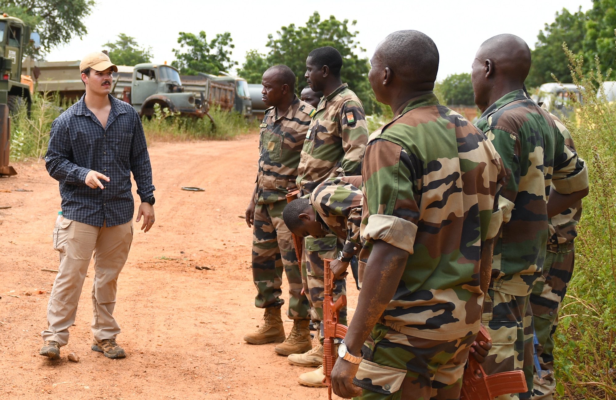 U.S. Air Force Senior Airman Caleb Love, 768th Expeditionary Air Base Squadron Explosive Ordnance Disposal team member, teaches members of the Forces Armées Nigeriennes (Nigerien Armed Forces) Genie Unit how to locate an improvised explosive device during an IED Awareness Course in Niamey, Niger, Oct. 11, 2019. During this week-long course, the FAN learned how to locate and react to an IED, how set up a cordon and the procedures to clear the area. (U.S. Air Force photo by Staff Sgt. Alex Fox Echols III)