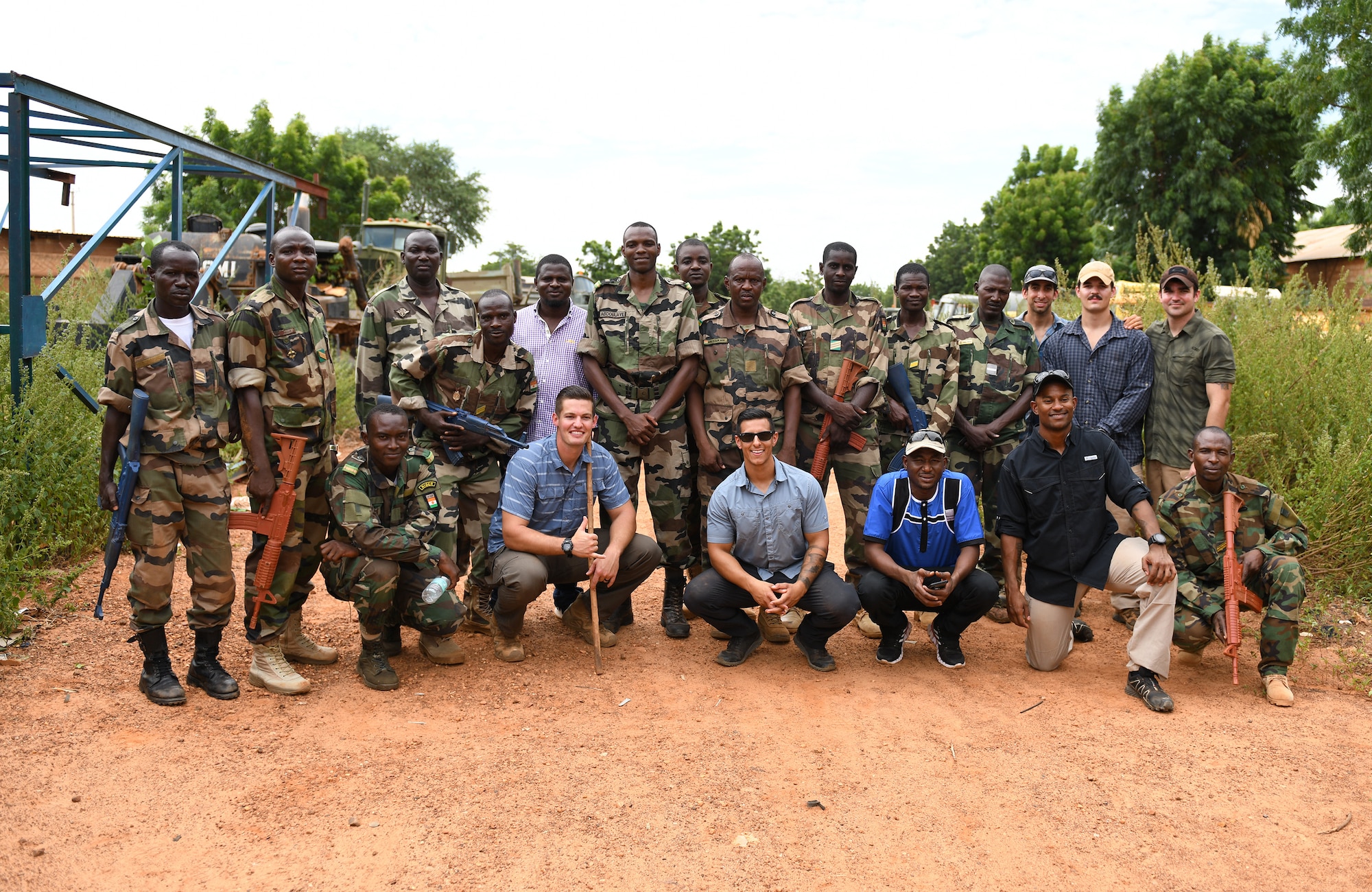 U.S. Air Force Airmen assigned to the 768th Expeditionary Air Base Squadron and members of the Forces Armées Nigeriennes (Nigerien Armed Forces) pose for a photo during an Improvised Explosive Device Awareness Course for the in Niamey, Niger, Oct. 11, 2019. The course is part of a curriculum spanning several months designed to improve the FAN’s effectiveness and survivability once they deploy to combat the violent extremist organizations in West Africa. (U.S. Air Force photo by Staff Sgt. Alex Fox Echols III)