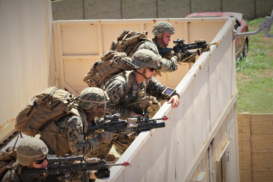 A Marine Corps squad leader with Charlie Company, 1st Battalion, 3rd Marine Regiment uses the Marine Air-Ground Task Force Common Handheld to communicate during the Island Marauder exercise aboard Marine Corps Base Hawaii, Kaneohe Bay, on Sept. 24, 2019. Marines had the ability to use emerging command and control technologies, including an enhanced version of the MCH, during the exercise. (U.S. Marine Corps photo by Ashley Calingo)