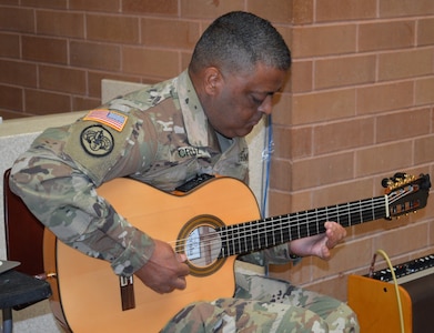 Staff Sgt. Jamie Cruz, Brooke Army Medical Center Warrior Transition Battalion, entertains the audience during a Hispanic Heritage Month celebration in the hospital’s Medical Mall Oct. 11, 2019.