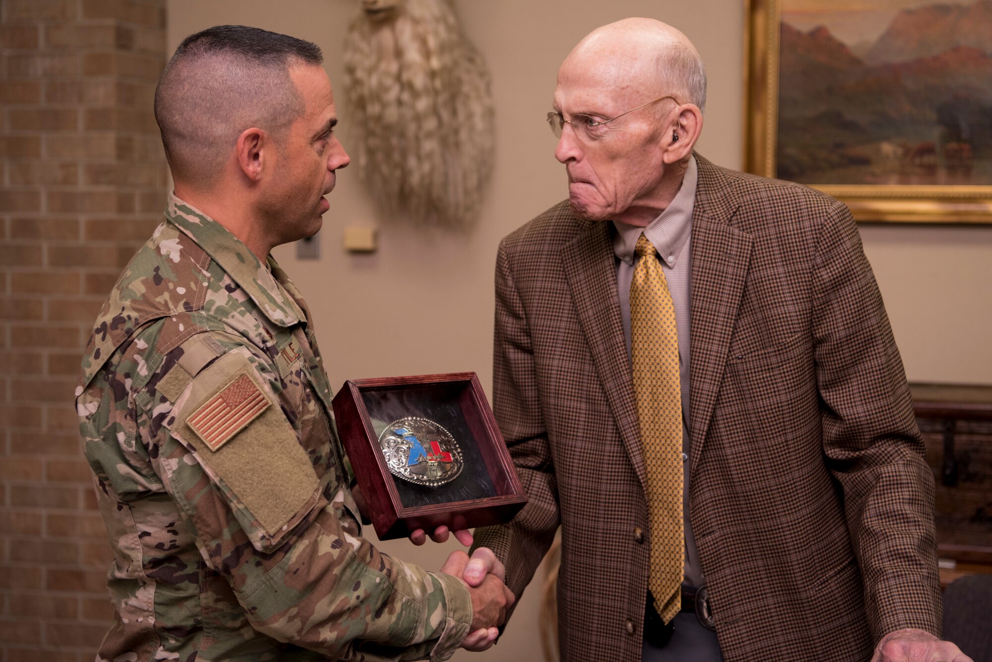 Bill Cauthorn, lifelong honorary commander, receives a custom Laughlin belt buckle from Col. Lee Gentile, 47th Flying Training Wing commander, in Del Rio, Texas, Oct. 15, 2019. Cauthorn is the CEO of The Bank and Trust, and has been a lifelong supporter of Laughlin Air Force Base. (U.S. Air Force photo by Senior Airman Marco A. Gomez)