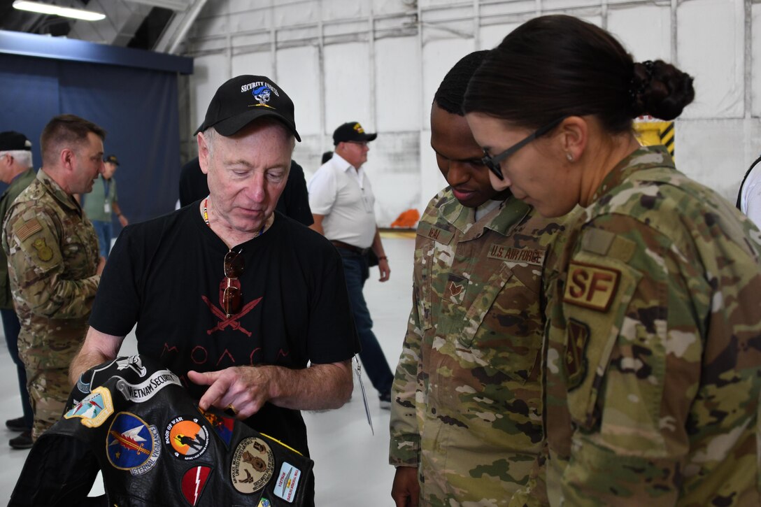 A Vietnam Security Police Association member shows patches he earned during his military career to security forces Airmen during the association’s 25th anniversary held at Joint Base Andrews, Md., Oct. 10, 2019. The VSPA is an association of U.S. Air Force veterans who served in Vietnam or Thailand between July 1958 and May 1975. (U.S. Air Force photo by Airman 1st Class Spencer Slocum)