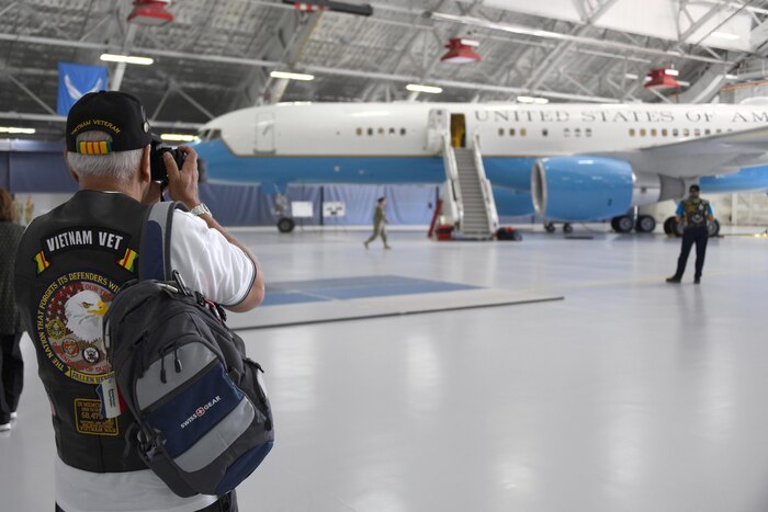 A Vietnam Security Police Association member takes a photo of an aircraft during their 25th anniversary held at Joint Base Andrews, Md., Oct. 10, 2019. During the day, they were also shown a military working dog demonstration, a weapons and equipment display, and a simulated firing range, all while getting to spend some time with JBA defenders. (U.S. Air Force photo by Airman 1st Class Spencer Slocum)
