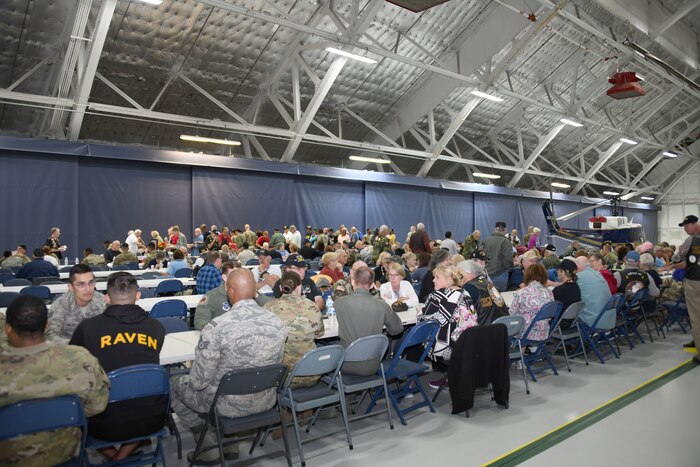 Vietnam Security Police Association members and defenders socialize during the VSPA 25th anniversary held at Joint Base Andrews, Md., Oct. 10, 2019. Airmen, past and present, exchanged stories from their careers as defenders. (U.S. Air Force photo by Airman 1st Class Spencer Slocum)