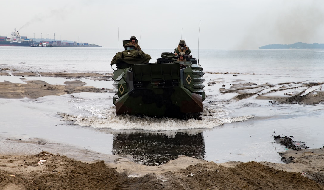 U.S. Marines with Assault Amphibious Vehicle Platoon, Echo Company, Battalion Landing Team 2nd Battalion, 5th Marines, 31st Marine Expeditionary Unit and the Philippine Marine Corps land on the beach in assault amphibious vehicles during KAMANDAG 2 in Subic Bay, Philippines, Oct. 3, 2018. KAMANDAG helps maintain a high level of readiness and enhances bilateral military-to-military relations and capabilities.
