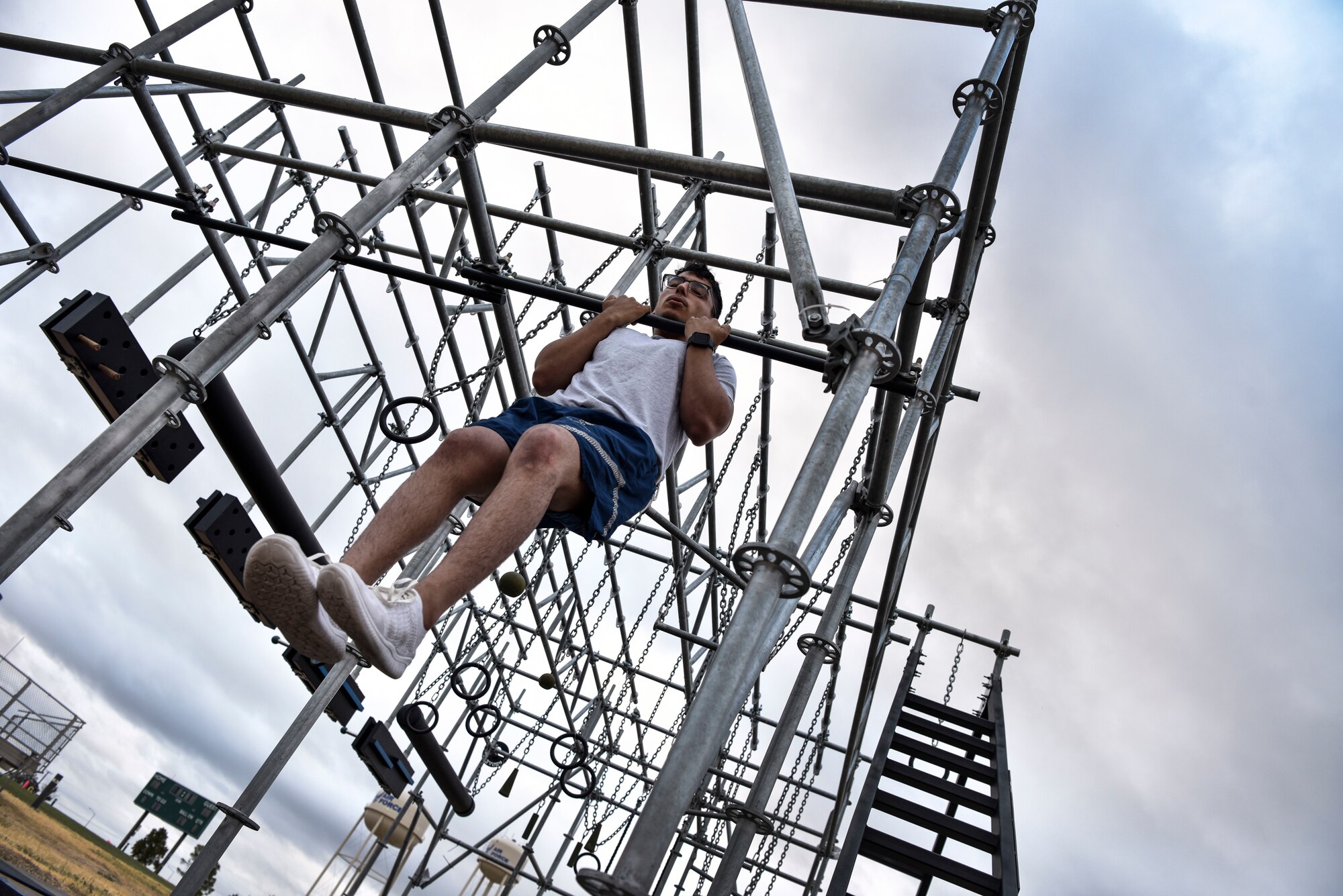 Airman 1st Class Marc Cisneros, a 47th Security Forces Squadron installation entry controller, performs a chin-up at Laughlin Air Force Base, Texas, Oct. 10, 2019. One component of the German Armed Forces Badge for Military Proficiency qualification test is being able to hold a chin up for more than 60 seconds. (U.S. Air Force photo by Senior Airman Marco A. Gomez)