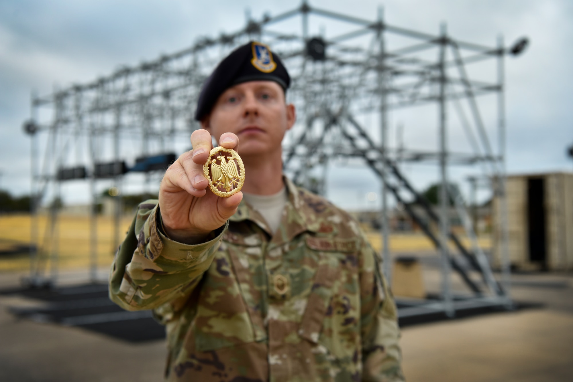 Master Sgt. Christopher Long, 47th Security Forces Squadron logistics and resources superintendent, holds a German Armed Forces Badge for Military Proficiency at Laughlin Air Force Base, Texas, Oct. 10, 2019. “This was a great opportunity for our defenders to broaden their horizon and participate in activities outside their scope and challenge their abilities,” said Long. (U.S. Air Force photo by Senior Airman Marco A. Gomez)