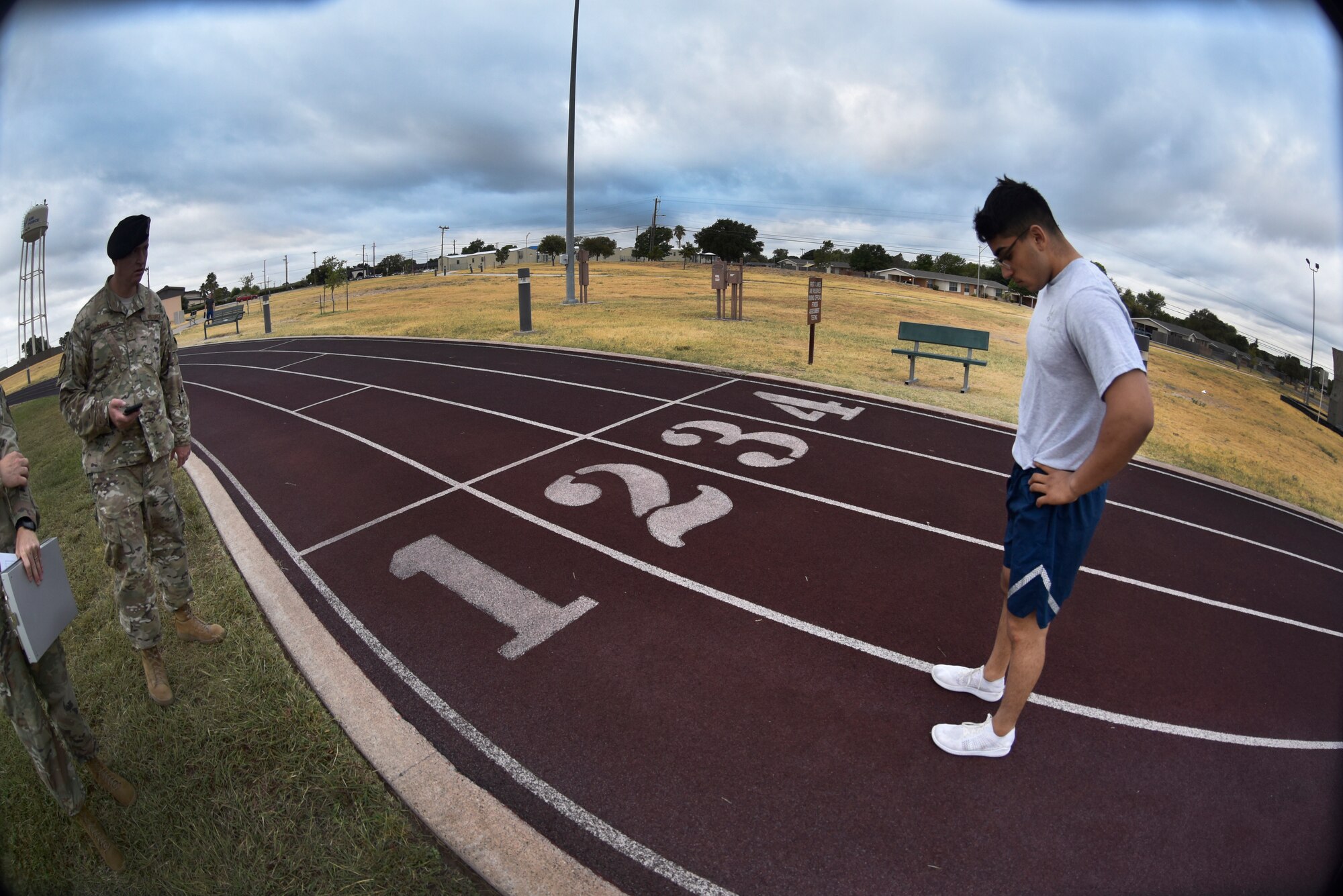 Airman 1st Class Marc Cisneros, a 47th Security Forces Squadron installation entry controller, prepares to run at Laughlin Air Force Base, Texas, Oct. 10, 2019. The German Armed Forces Badge for Military Proficiency qualification consists of a multi-phase test which includes an aquatics performance portion, German physical test, a 12-kilometer ruck march, CBRN and combat life saver test. (U.S. Air Force photo by Senior Airman Marco A. Gomez)
