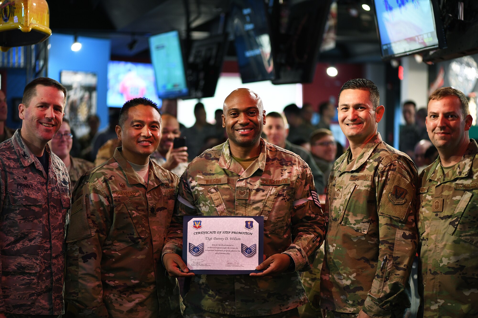 Staff Sgt. Danny D. Wilson, 319th Communications Squadron Information Technology Asset Management Noncommissioned Officer in charge, poses with 319th Reconnaissance Wing and 319th CS leadership for a photo during Wilson's Stripes for Exceptional Performers promotion announcement Oct. 4, 2019 on Grand Forks Air Force Base, North Dakota. STEP promotion from staff sergeant to technical sergeant is a prestigious promotion for exceptional airmen. (U.S. Air Force photo by Senior Airman Elijaih Tiggs)
