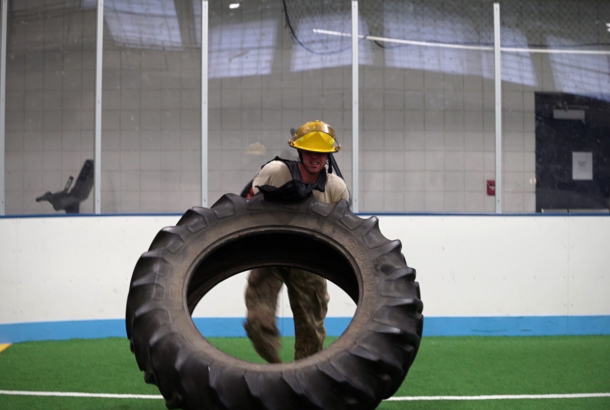 Master Sgt. Richard Mathews, 319th Logistics Readiness Squadron materiel management flight chief, flips a firetruck tire during the base commander’s annual firefighter challenge Oct. 10, 2019, on Grand Forks Air Force Base, North Dakota. The challenge, a National Fire Prevention Week event, brought awareness to this year’s fire safety theme: “Not every hero wears a cape. Plan and practice your escape.” (U.S. Air Force photo by Senior Airman Elora J. Martinez)