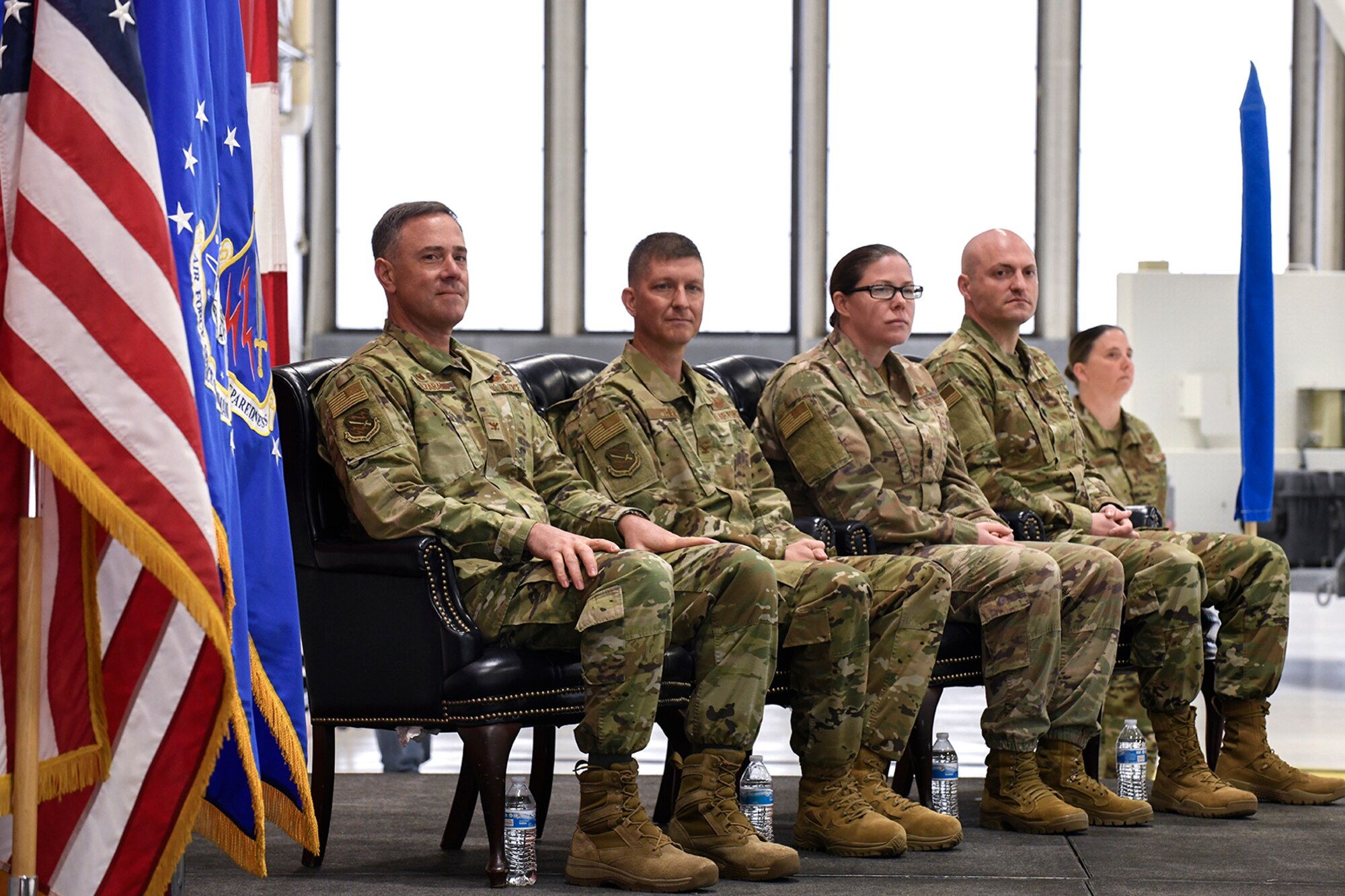 Col. Thomas Falzarano, 21st Space Wing Commander; Col. John Thien, 721st Operations Group commander; Lt. Col. Susan Bedell, 5th Space Control Squadron commander; and Lt. Col. Matthew Thompson, 721st Operations Support Squadron commander, sit on stage during an activation ceremony Oct. 10, 2019 at Peterson Air Force Base, Colorado. The 721st OG, 5th SPCS and 721st OSS were part of a restructure of manpower to protect and defend U.S. security space capabilities. (U.S. Air Force photo by Craig Denton)