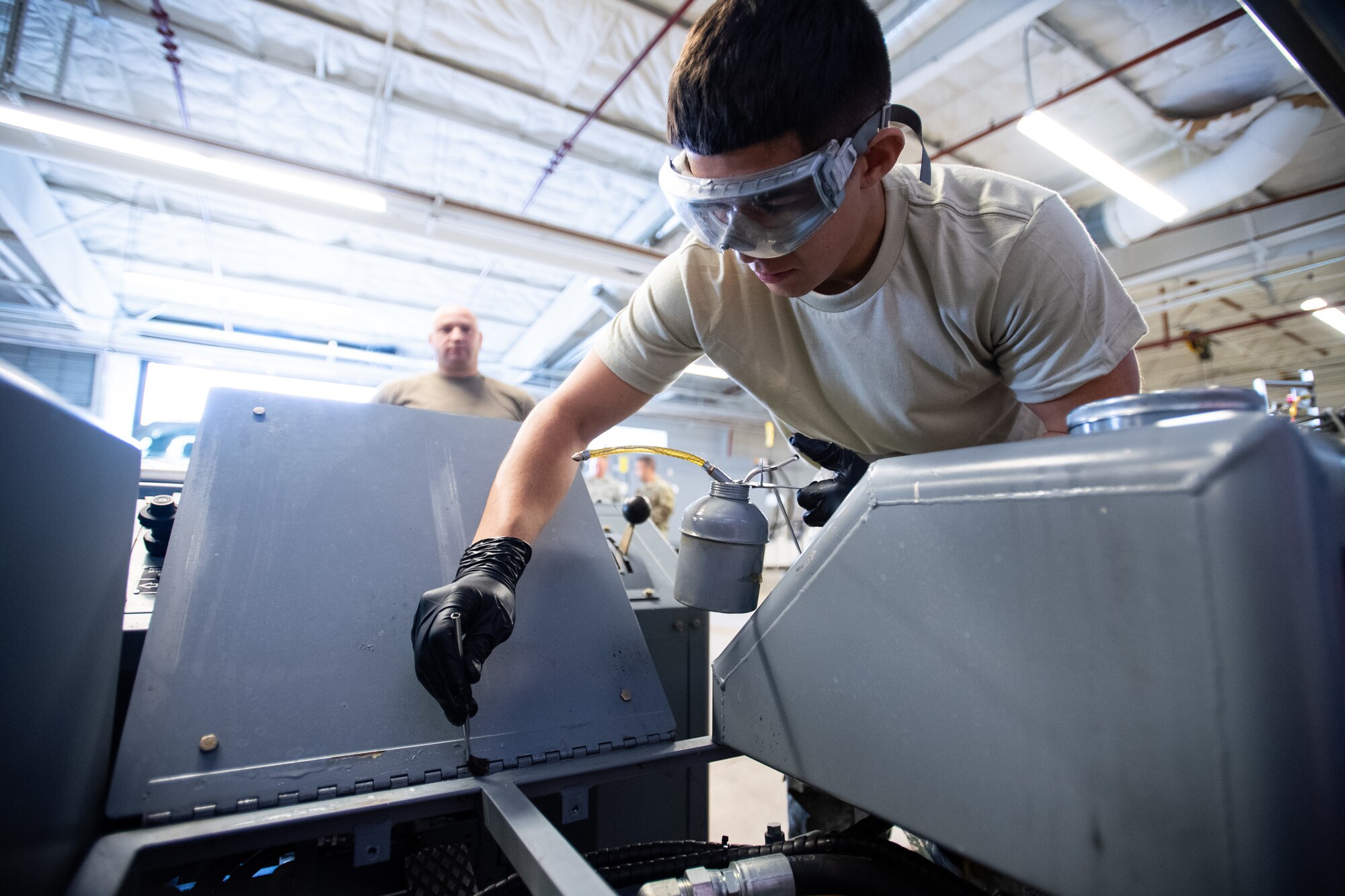Airman 1st Class Javier Saldana, 388th Aerospace Ground Equipment Flight, performs maintenance on a munitions loader at Hill Air Force Base, Utah, Oct. 4, 2019. Unit Airmen maintain over 600 pieces of equipment that support the mission of crew chiefs, avionics, weapons and ammo troops. (U.S. Air Force photo by R. Nial Bradshaw)