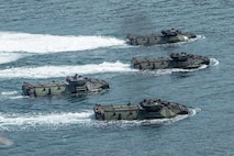Assault amphibious vehicles participate in an amphibious landing during exercise KAMANDAG 3