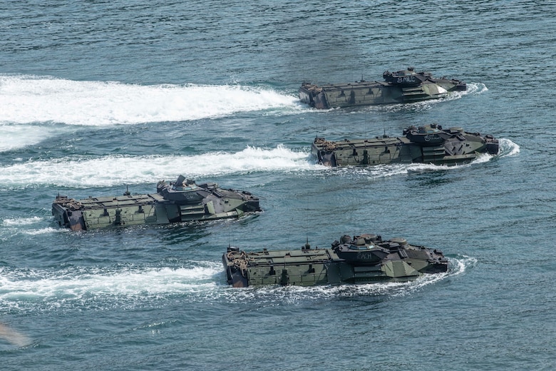 Assault amphibious vehicles participate in an amphibious landing during exercise KAMANDAG 3