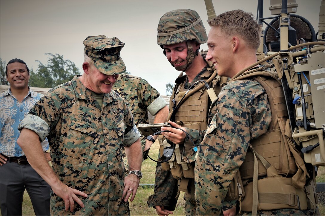 U.S. Marines with Charlie Company, 1st Battalion, 3rd Marine Regiment, show Brig. Gen. Robert Sofge, Deputy Commander, Marine Forces Pacific, a Marine Air-Ground Task Force Common Handheld during the Island Marauder Exercise on Marine Corps Base Hawaii, Kaneohe Bay, Sept. 25, 2019. Sofge was one of the Marine Corps stakeholders attending the event. The Island Marauder exercise is a training event during which Marines conducted different scenarios while testing new technology on the battlefield. (U.S. Marine Corps photo by Ashley Calingo)