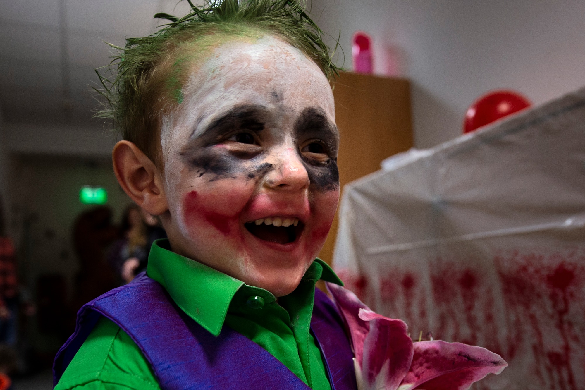 Jacob Goldfuss, 3, son of U.S. Air Force Master Sgt. Austin May, 52nd Fighter Wing Public Affairs community engagement section chief, and Staff Sgt. Candace Goldfuss, 52nd Security Forces Squadron Operations NCO, trick-or-treats during a deployed-family event in the Airman and Family Readiness Center at Spangdahlem Air Base, Germany, Oct. 17, 2019. Jacob, whose mother is currently deployed, dressed as "The Jaker." The A&FRC's program aims to bring deployment-affected families together and give back to the community. (U.S. Air Force photo by Airman 1st Class Valerie Seelye)