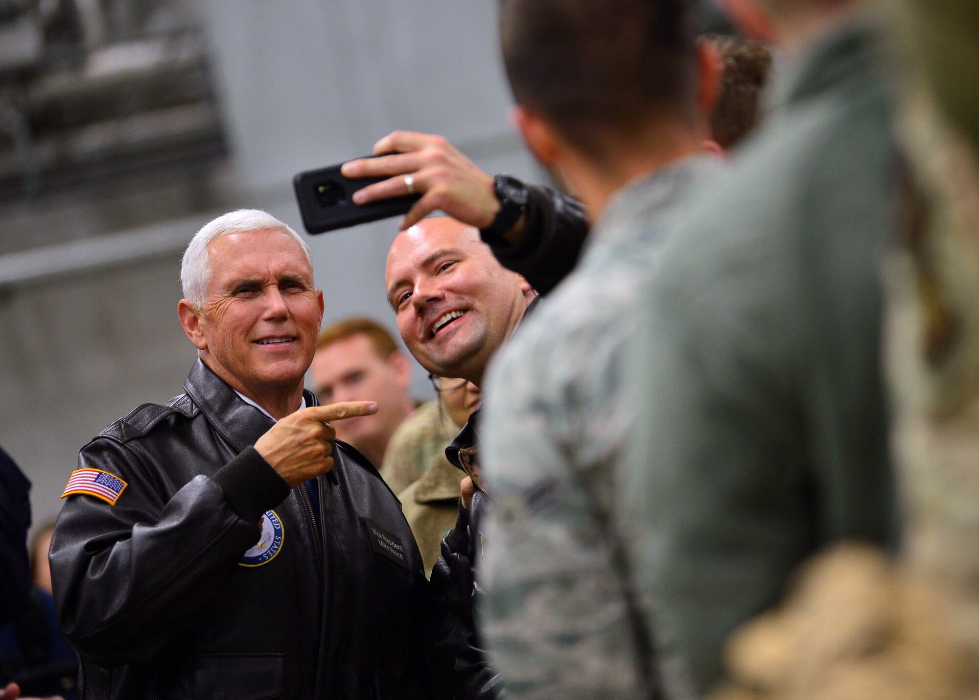 U.S. Vice President Mike Pence takes a photo with an Airman at an all-call on Ramstein Air Base, Germany, Oct. 18, 2019. After addressing Airmen, Pence took time to meet them and show his support for their dedication to freedom. (U.S. Air Force photo by Staff Sgt. Jimmie D. Pike)
