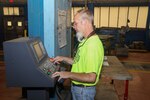 Sheet Metal Mechanic Ryan Ward operates the new LVD Strippit Machine in the Sheet Metal Shop (Shop 17).