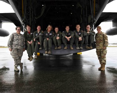 Staff Sgt. Stephanie Rowland, Lt. Col. Kenda Garrett, Master Sgt. Erin Evans, Staff Sgt. Jessica McGilton, Maj. Janelle Guillebeau, Senior Airman Ashlyn Hendrickson, Technical Sgt. Nicole Beck, Lt. Col. Sarah O’Banion, and Staff Sgt. Tracie Winston after landing in Abbottsford, British Columbia, Canada, to support the annual Sky’s No Limit – Girls Fly Too aerial symposium. This is the first all-female C-130H crew in the history of the annual event.