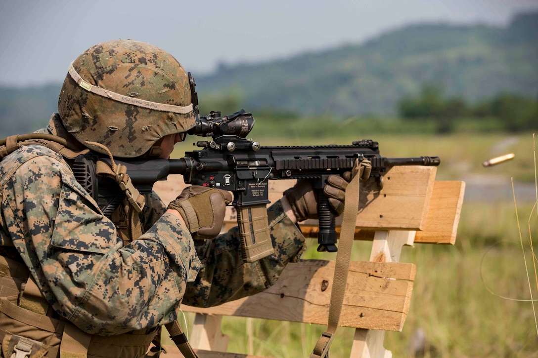 U.S. Marine Lance Cpl. Ryan Watts fires an M27 Infantry Automatic Rifle while participating in a live-fire range during exercise KAMANDAG 3, on Colonel Ernesto P. Ravina Air Base, Philippines, Oct. 12.