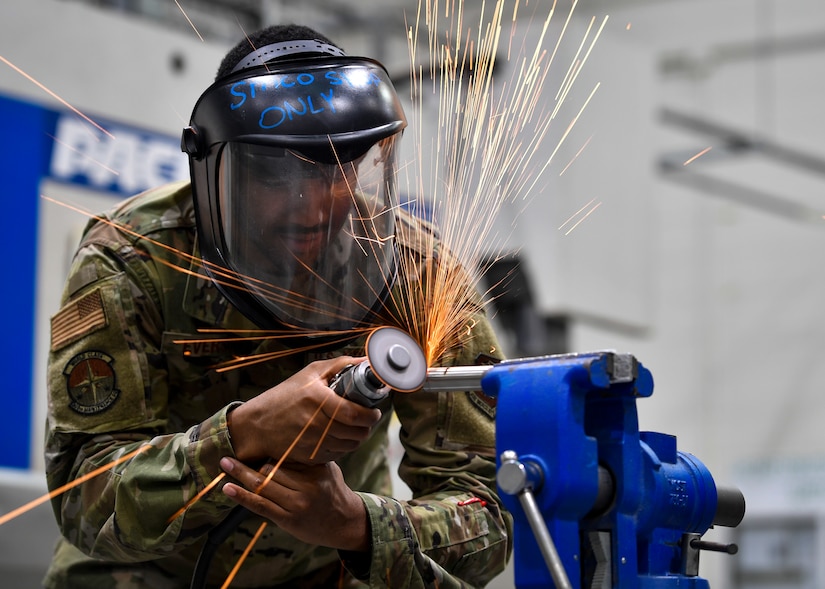 U.S. Air Force Senior Airman Armani Everson, 305th Maintenance Squadron Fabrication Flight aircraft structural maintenance journeymen, cuts into a piece of titanium used for aircrafts on Joint Base McGuire-Dix-Lakehurst, New Jersey, Oct. 16, 2019. Utilizing various methods, aircraft structural maintenance Airmen are able to build a replacement part from scratch in order to restore the structural integrity of the aircraft and ensure the safety of the Airmen who fly them. The mission of the 305th MXS is to enhance global response by providing world class systems, support equipment, munitions and aircraft maintenance. (U.S. Air Force photo by Senior Airman Jake Carter)