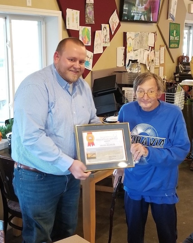 Rathbun Lake, Lead Park Ranger Jordon Griffin presenting volunteer Frank Ollinger a certificate recognizing his extraordinary volunteer efforts and October 16, 2019 at the Rathbun Lake Association annual meeting near Centerville, Iowa.