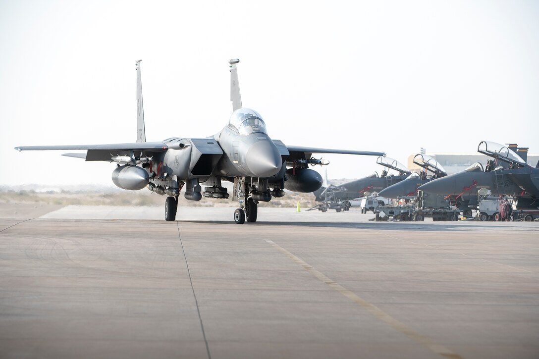 A U.S. Air Force F-15E Strike Eagle from the 494th Fighter Squadron taxi to park at Al Dhafra Air Base, United Arab Emirates, Oct. 18, 2019.