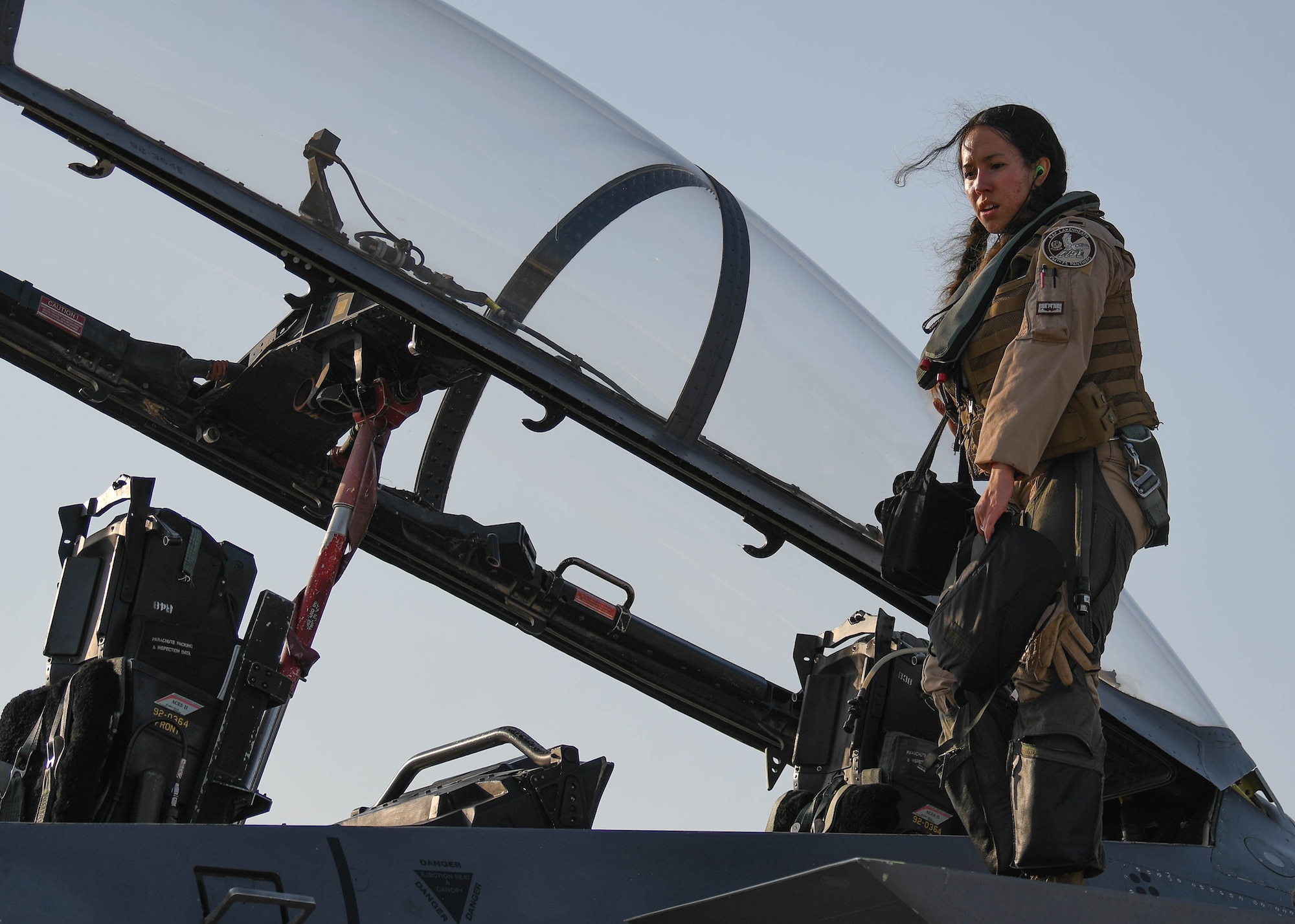 A weapons system officer from the 494th Fighter Squadron descends from a U.S. Air Force F-15E Strike Eagle Oct. 18, 2019, at Al Dhafra Air Base, United Arab Emirates, Oct. 18, 2019.