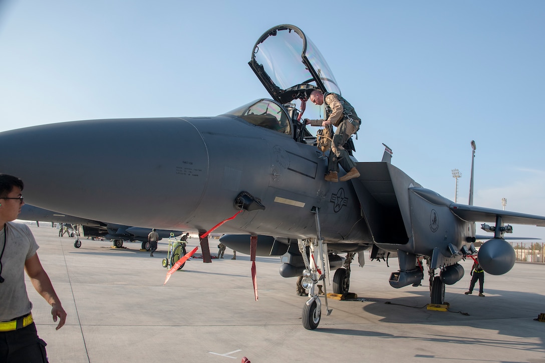 A pilot from the 494th Fighter Squadron descends from a U.S. Air Force F-15E Strike Eagle Oct. 18, 2019, at Al Dhafra Air Base, United Arab Emirates, Oct. 18, 2019.