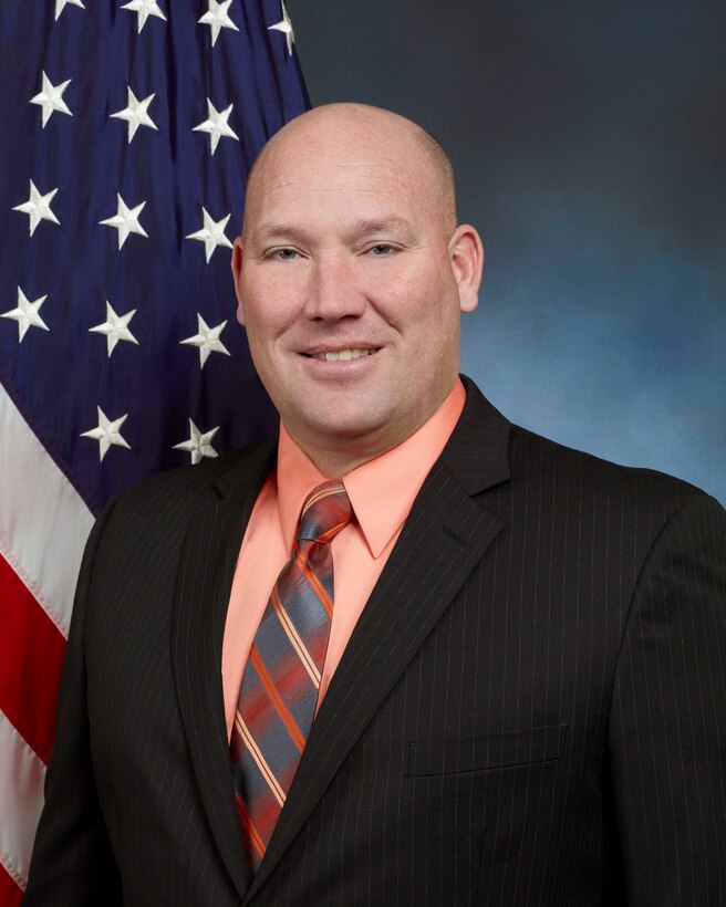 official photo with American flag in background