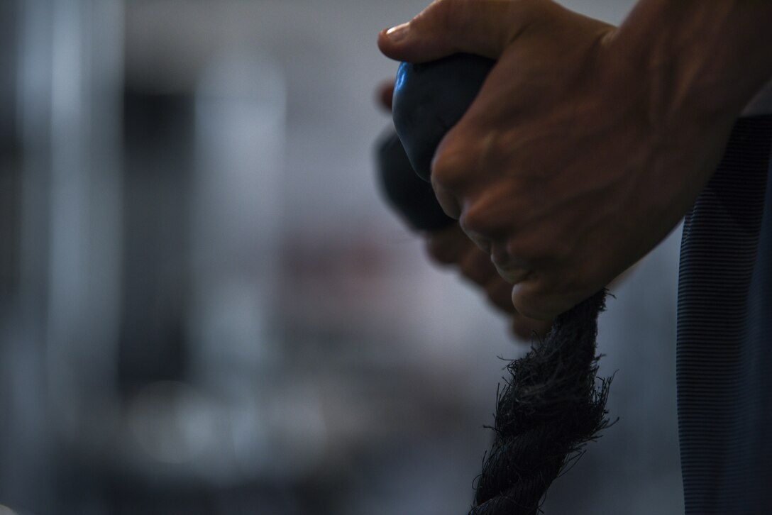 Major Richard Bottinelli, 90th Force Support Squadron operations officer, cable rope curls at the Independence Hall Fitness Center on F.E. Warren Air Force Base, Wyo., July 18, 2019. Bottinelli competed in the men’s physique category at the Orlando, Fla., bodybuilding competition, which focuses on muscularity, body conditioning, and symmetry with attention to aesthetics. (U.S. Air Force photo by Staff Sgt. Ashley N. Sokolov)