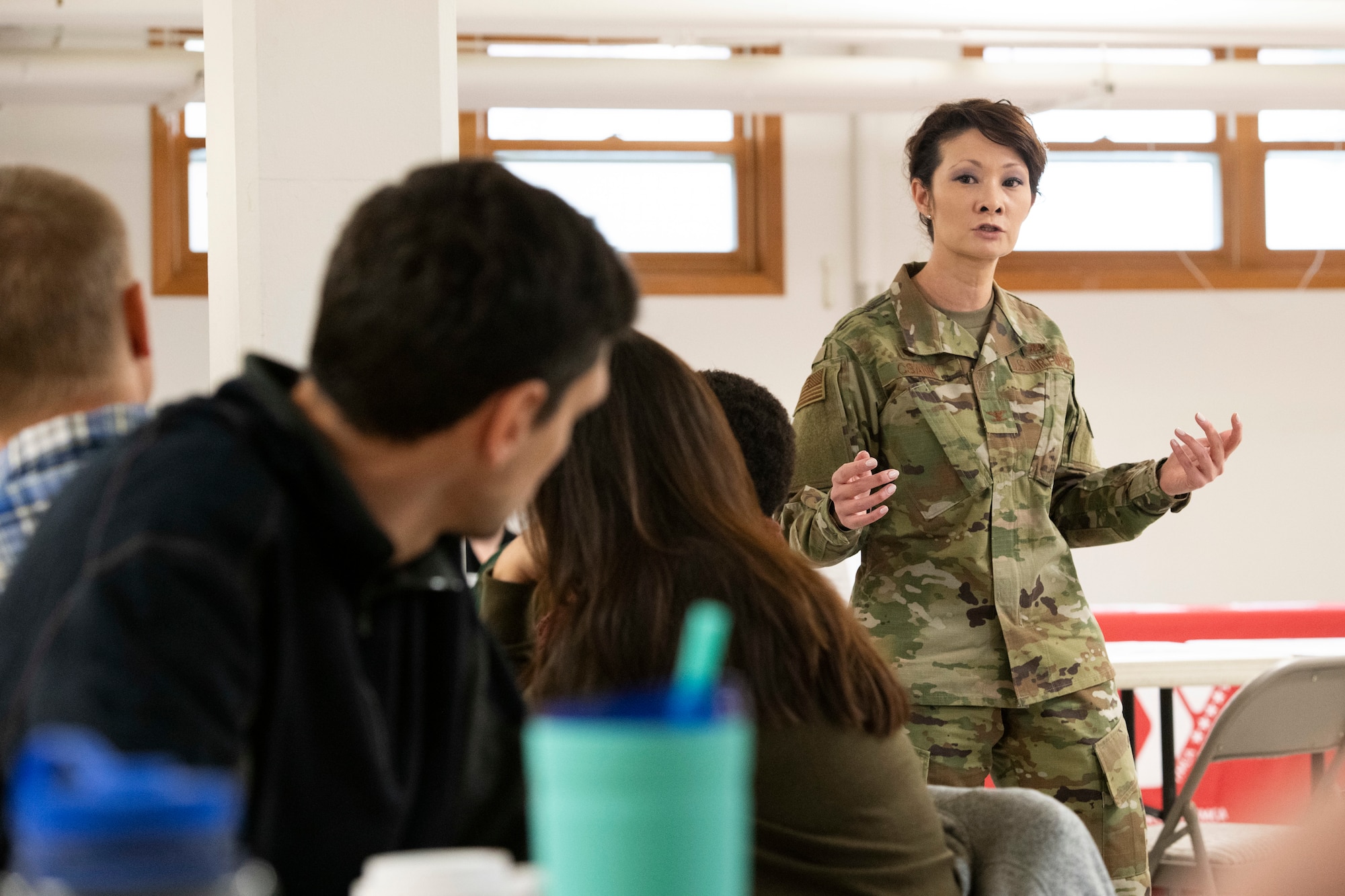 U.S. Air Force Col. Patricia Csànk, the commander of Joint Base Elmendorf-Richardson and the 673d Air Base Wing, speaks to attendees of the JBER Spouse Symposium held at JBER, Alaska, Oct. 16, 2019. The symposium enhanced resiliency by focusing on reflective and active listening, navigating interpersonal conflict, and strengthening communication to facilitate strong relationships between romantic partners, friends and family members.