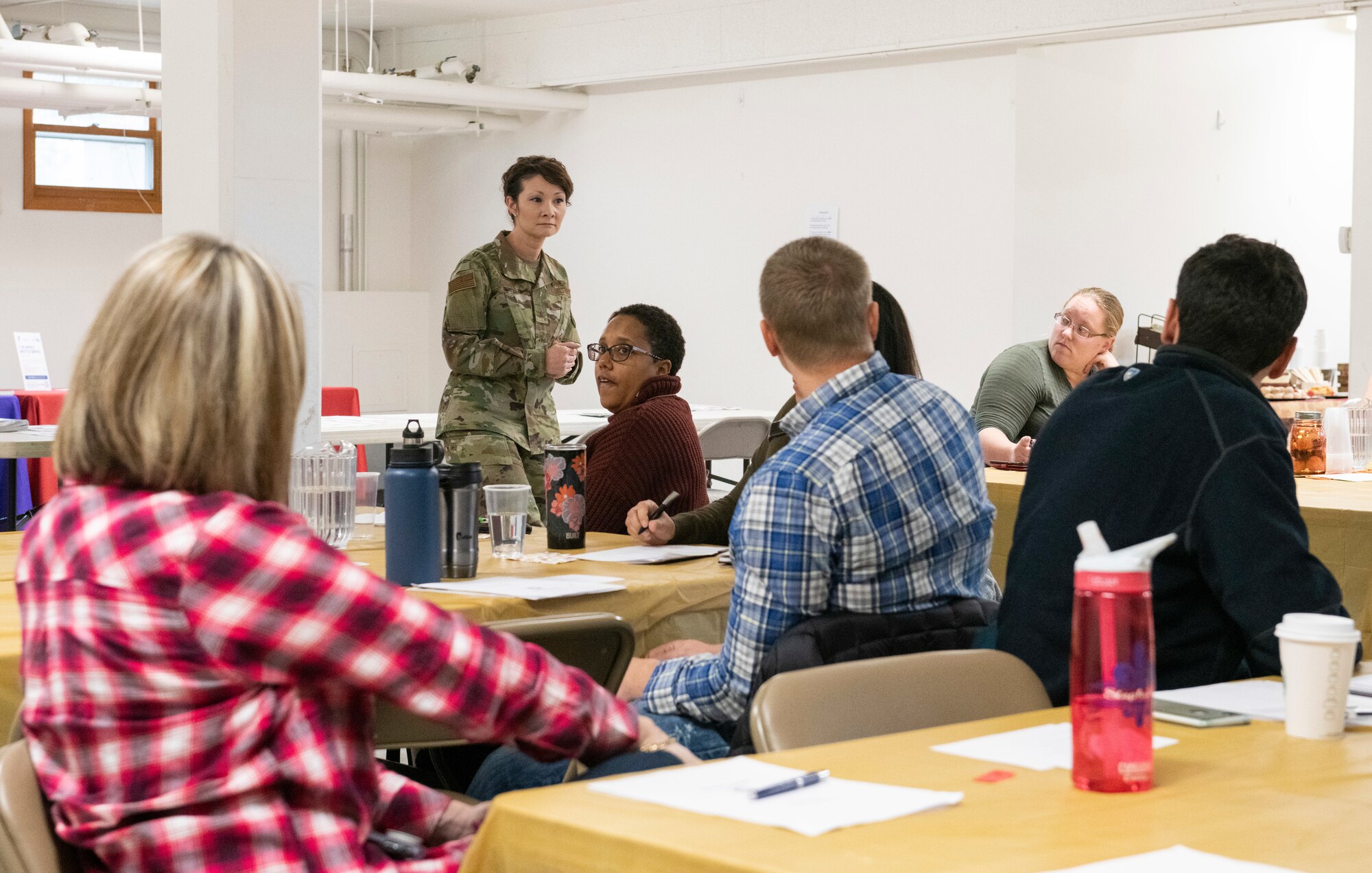 U.S. Air Force Col. Patricia Csànk, the commander of Joint Base Elmendorf-Richardson and the 673d Air Base Wing, speaks to attendees of the JBER Spouse Symposium held at JBER, Alaska, Oct. 16, 2019. The symposium enhanced resiliency by focusing on reflective and active listening, navigating interpersonal conflict, and strengthening communication to facilitate strong relationships between romantic partners, friends and family members.