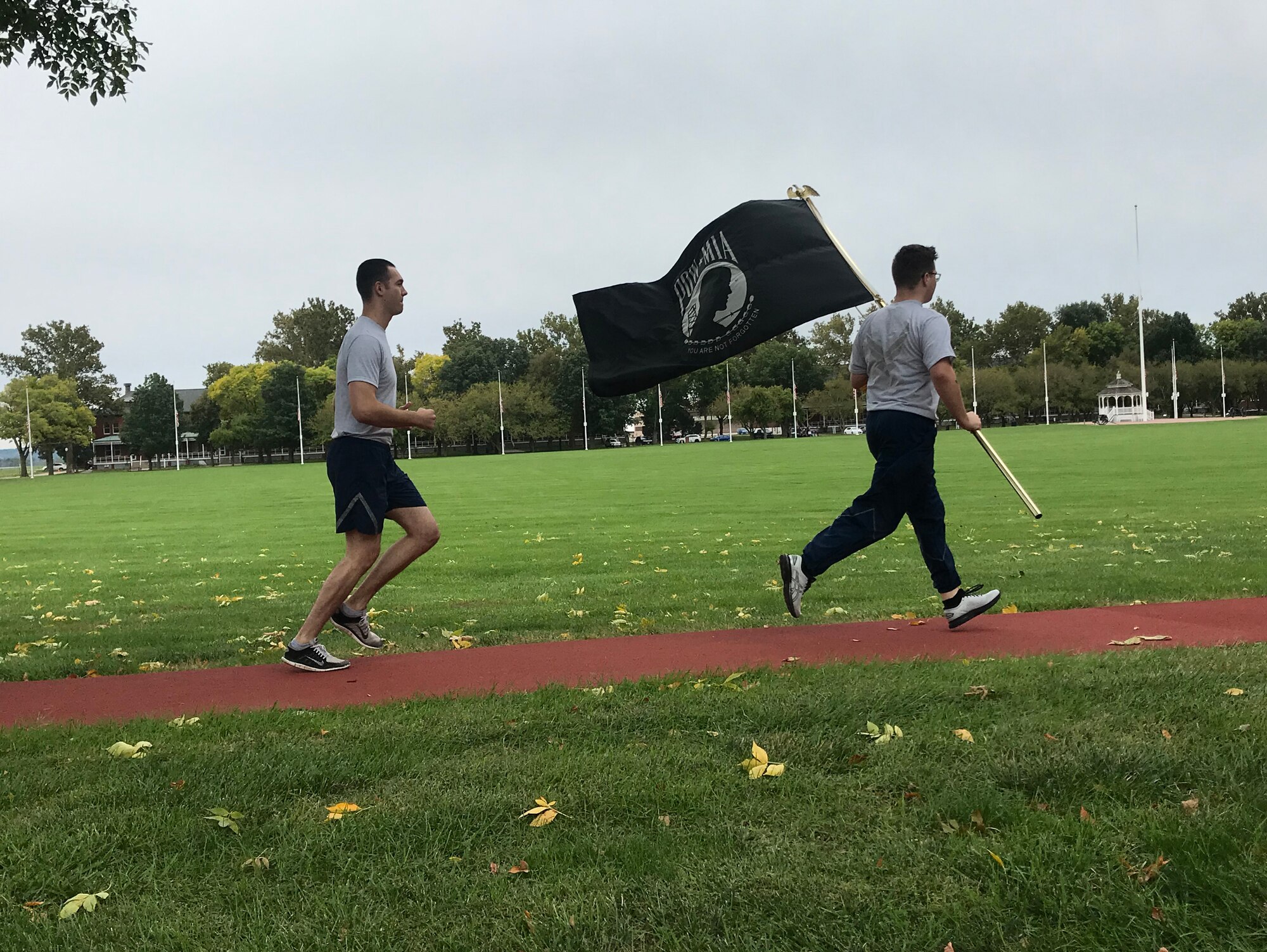 Members running with POW/MIA flag during 24 hour remembrance run