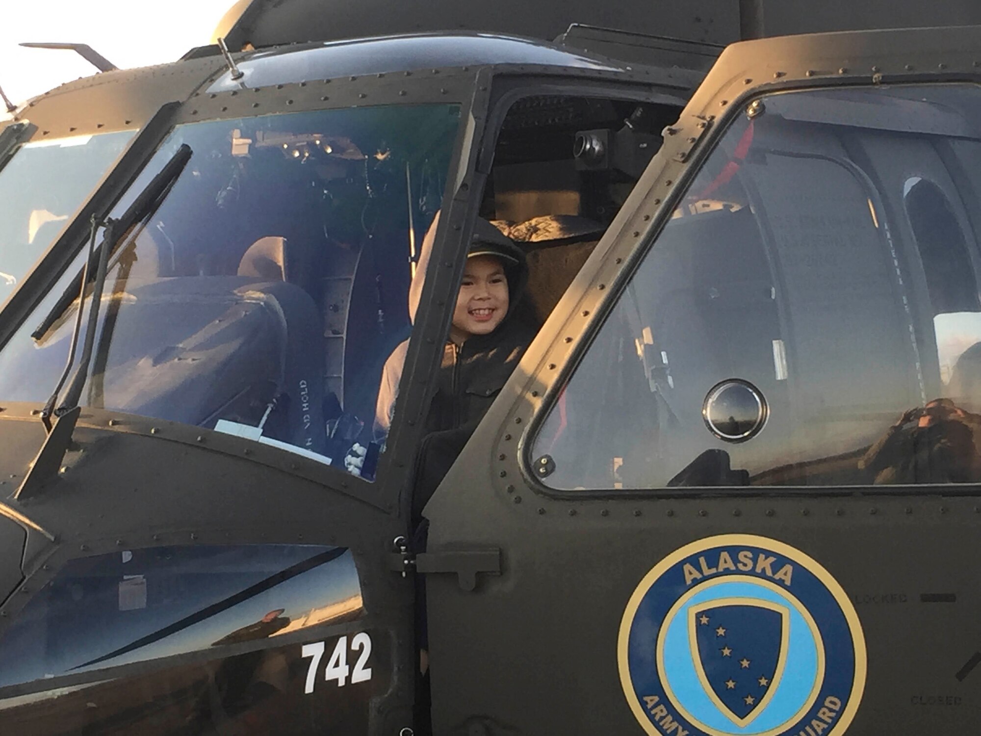 Carter Boyers, 9, checks out an Alaska Army National Guard UH-60 Black Hawk helicopter at the airstrip here Oct. 4, 2019. The helicopter crew was part of a small team visiting this Yukon River community to provide outreach services to veterans and build relationships for possible future Guard operations.
