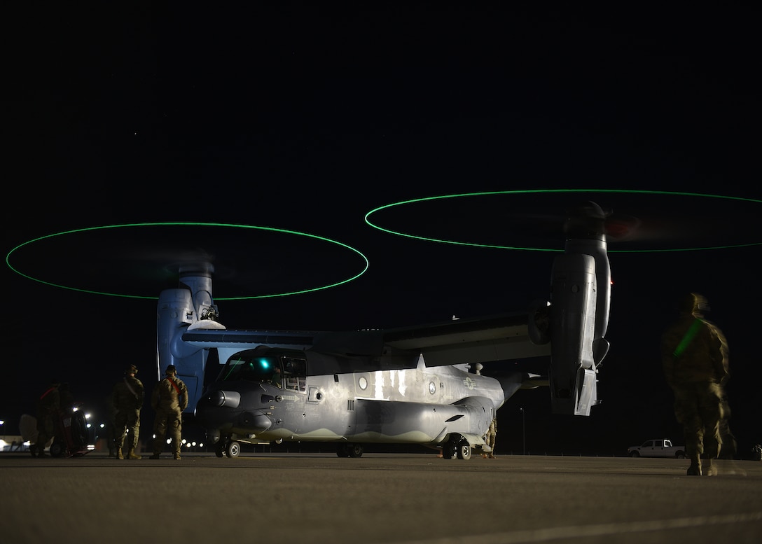 Tactical aircraft maintainers prepare to launch a CV-22B Osprey
