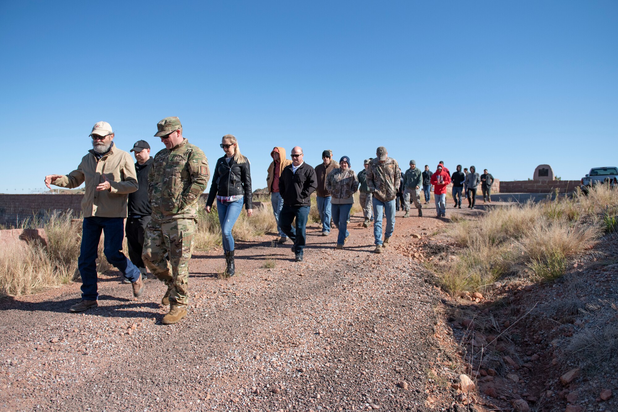 Airmen tour a dam.