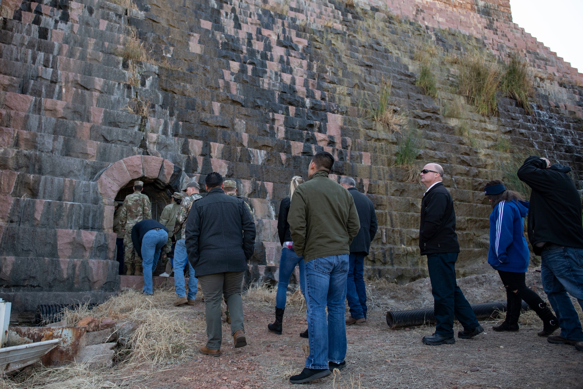 Airmen tour a dam.